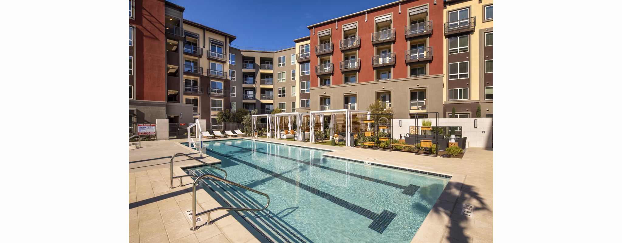 Stunning outdoor pool at Clarendon Apartments, luxury living with resort-style amenities
