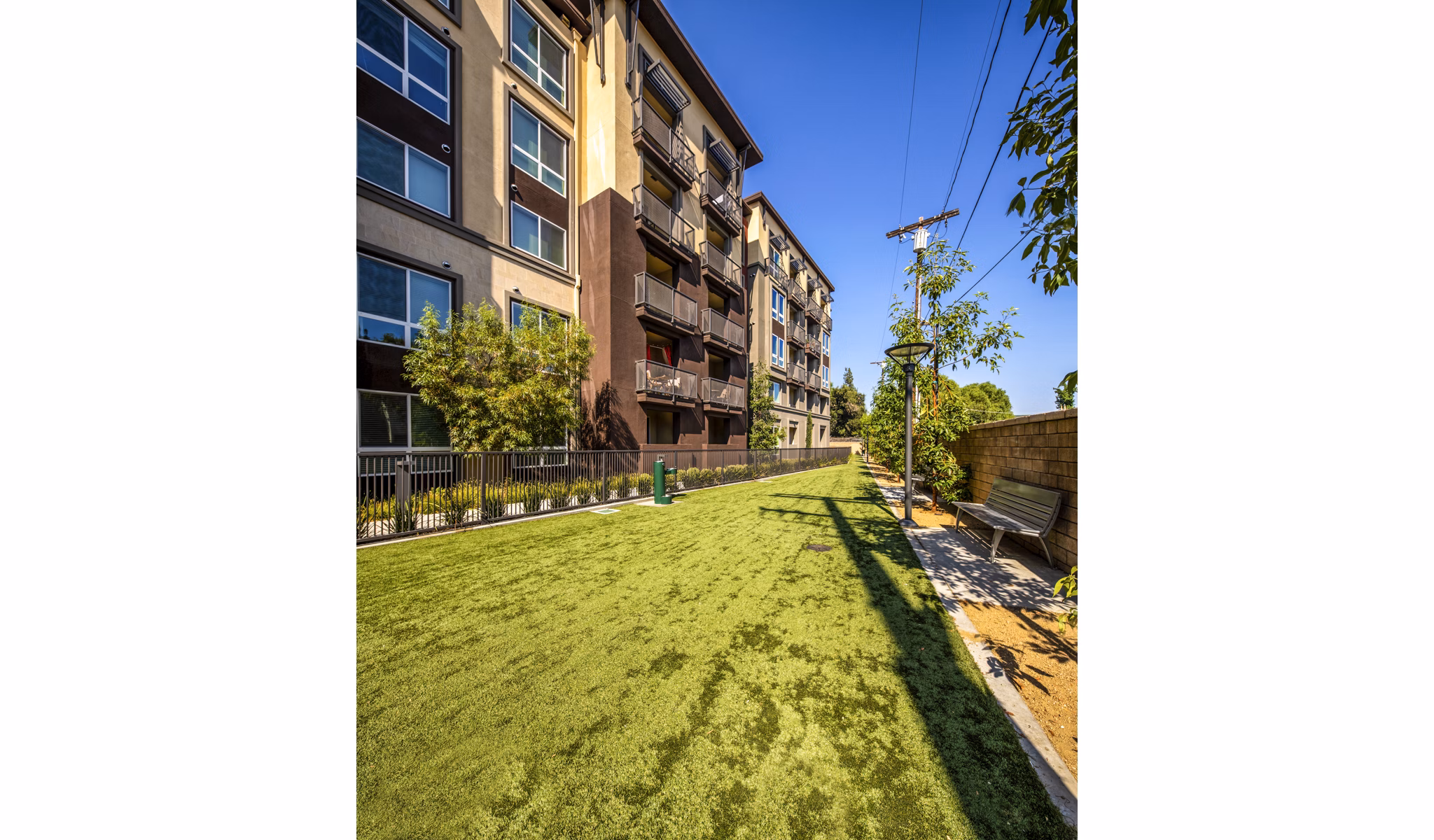 Dog park with agility equipment at Clarendon Apartments