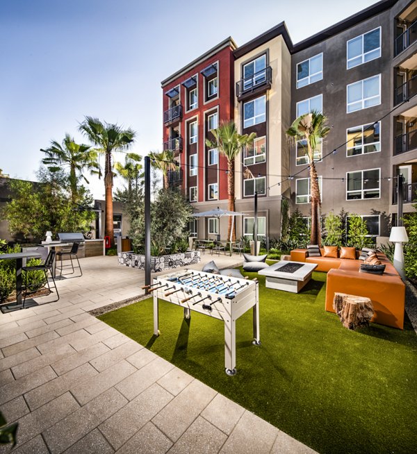 Outdoor grill area and sport court at Clarendon Apartments, perfect for active lifestyles and community gatherings