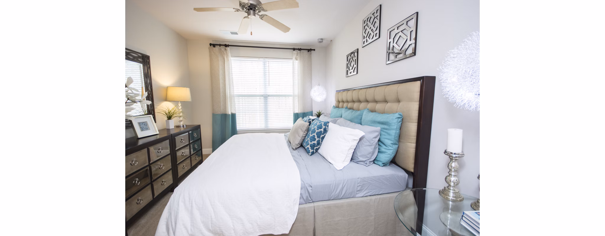 Cozy bedroom with modern decor at Tryon Place Apartments, ideal for urban living and comfort seekers in a luxury setting