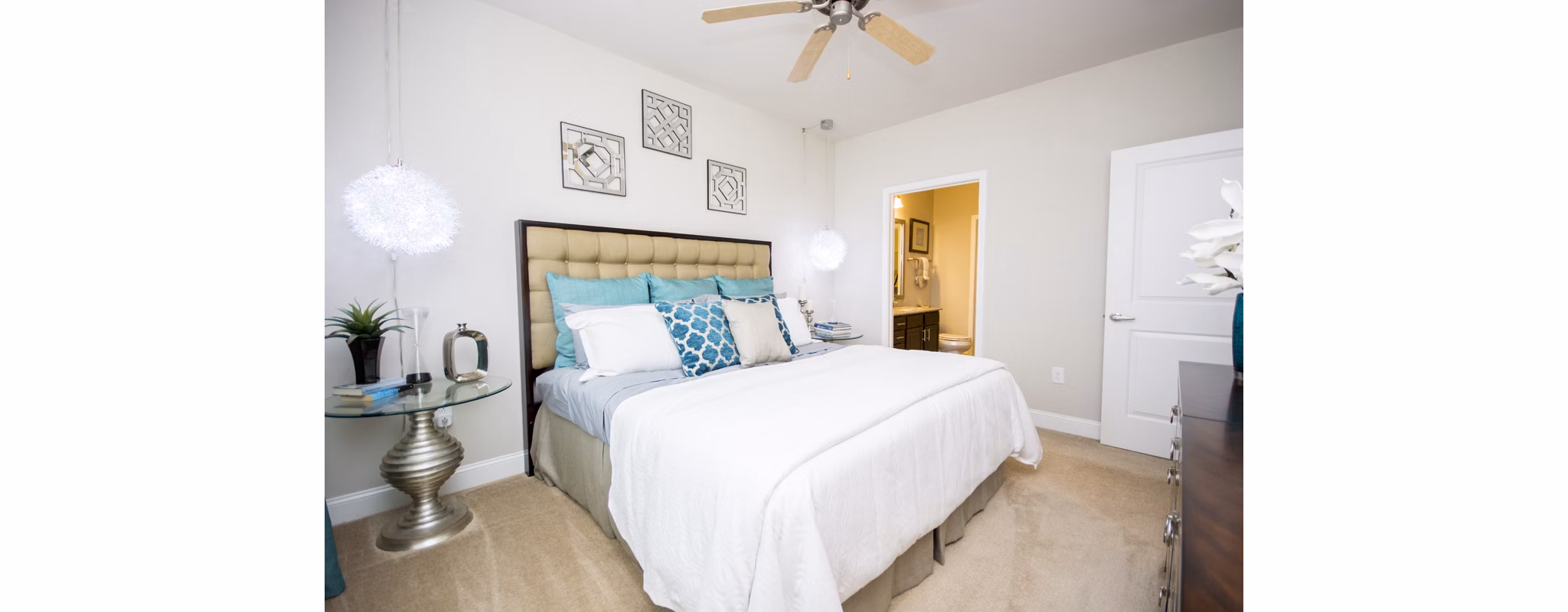 Bedroom with stylish decor and large windows at Tryon Place Apartments Luxury living experience in a well-designed Greystar community