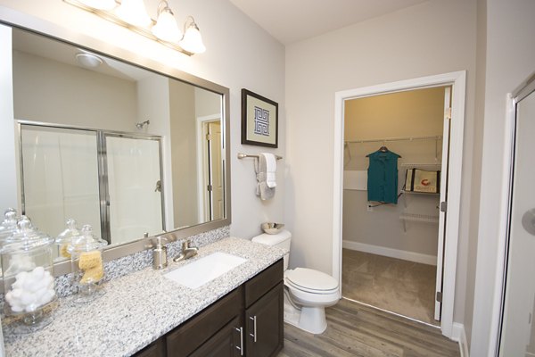 Elegant bathroom featuring modern fixtures at Tryon Place Apartments, a luxurious housing option by Greystar
