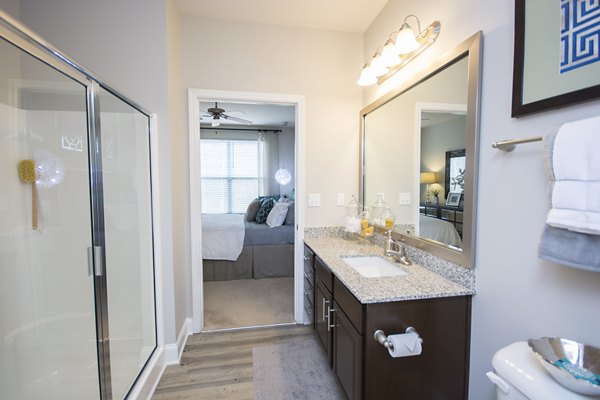 Luxurious bathroom featuring sleek fixtures and elegant design at Tryon Place Apartments