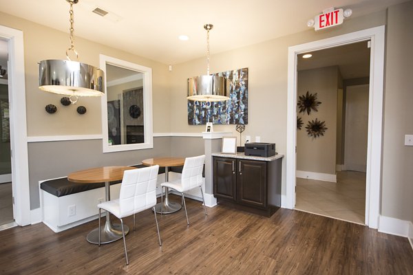 Modern business center with sleek workstations at Tryon Place Apartments, offering luxury amenities and convenience for residents