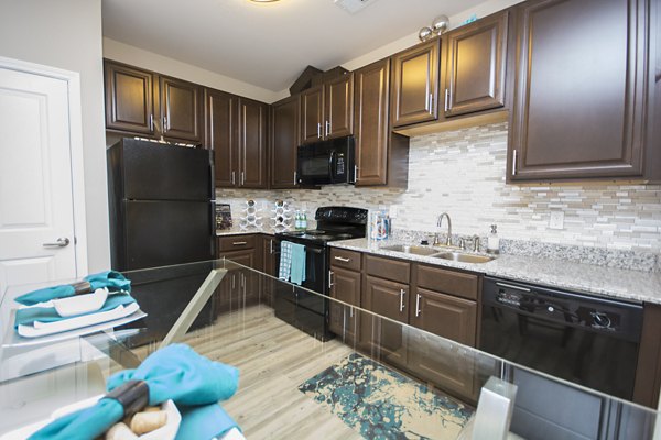 Spacious clubhouse featuring modern decor at Tryon Place Apartments, ideal for gatherings and events