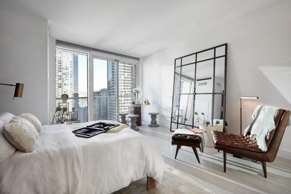 Stylish bedroom featuring modern decor and ample natural light at Jasper Apartments in Greystar's luxury community