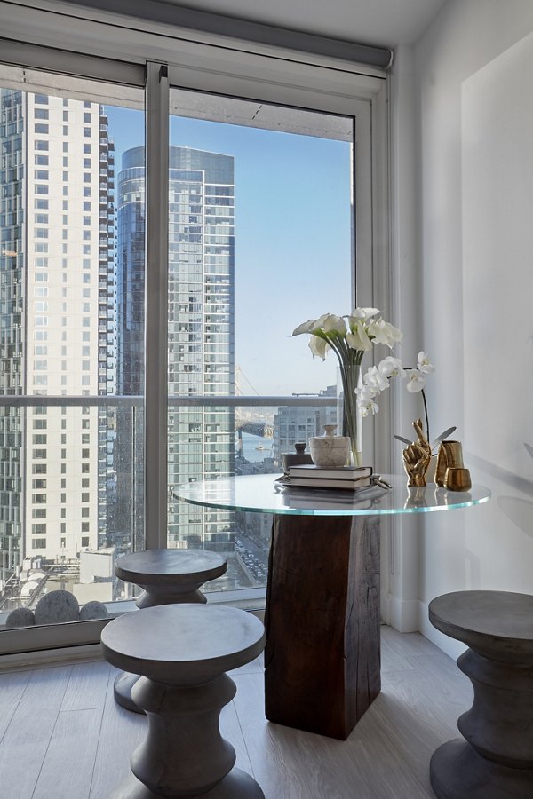 Dining room with modern decor and elegant lighting at Jasper Apartments