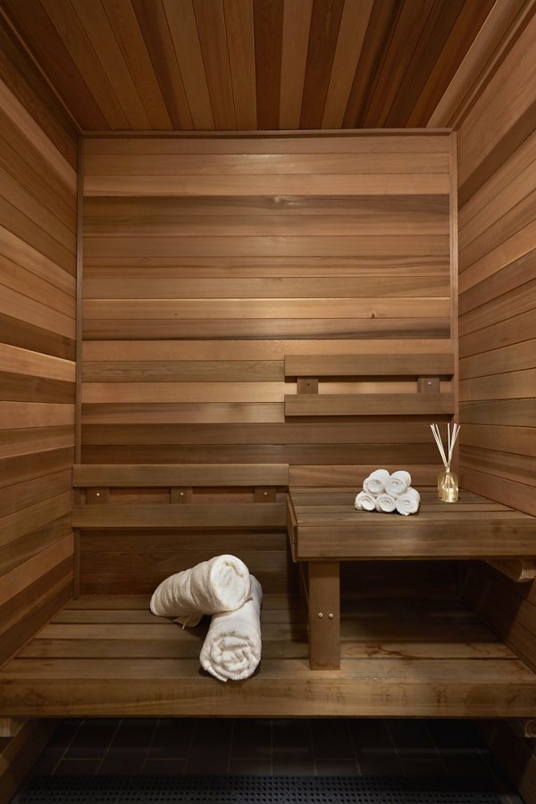 Relaxing sauna at Jasper Apartments with modern design and tranquil ambiance, providing a luxurious retreat for residents