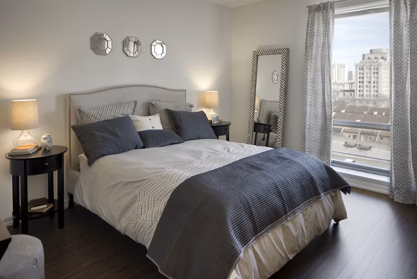 Modern bedroom featuring elegant decor in Edgewater Apartments