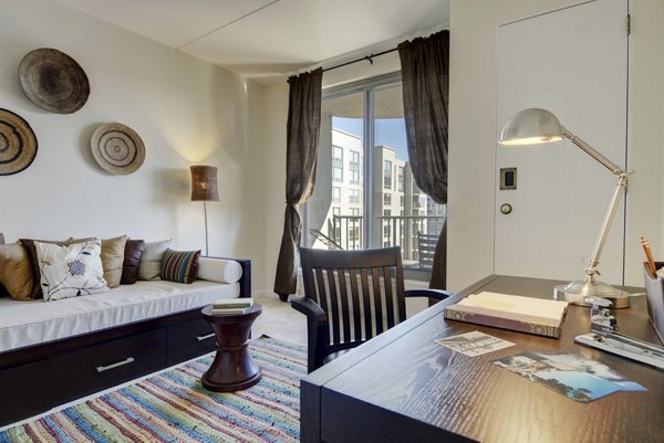 Cozy bedroom with modern decor at Edgewater Apartments, luxury living by the waterfront