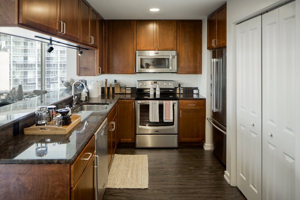 Modern kitchen with stainless steel appliances at Edgewater Apartments luxury living