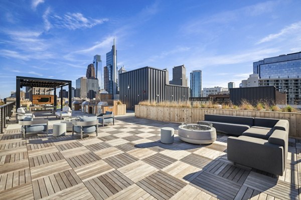 Scenic rooftop deck with lounge seating at Edgewater Apartments offering luxury views in a modern urban setting