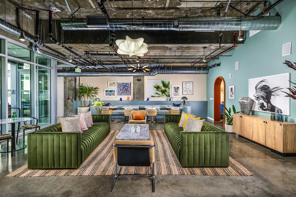 Clubhouse featuring modern design and spacious seating at WILCO Apartments