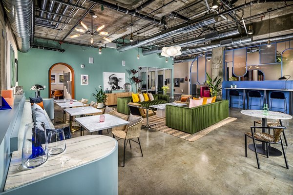 Elegant clubhouse with contemporary decor at WILCO Apartments, perfect for relaxation and social gatherings