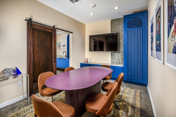 Clubhouse meeting facility featuring modern amenities at WILCO Apartments