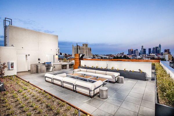 Cozy patio with modern furniture at WILCO Apartments offering serene views
