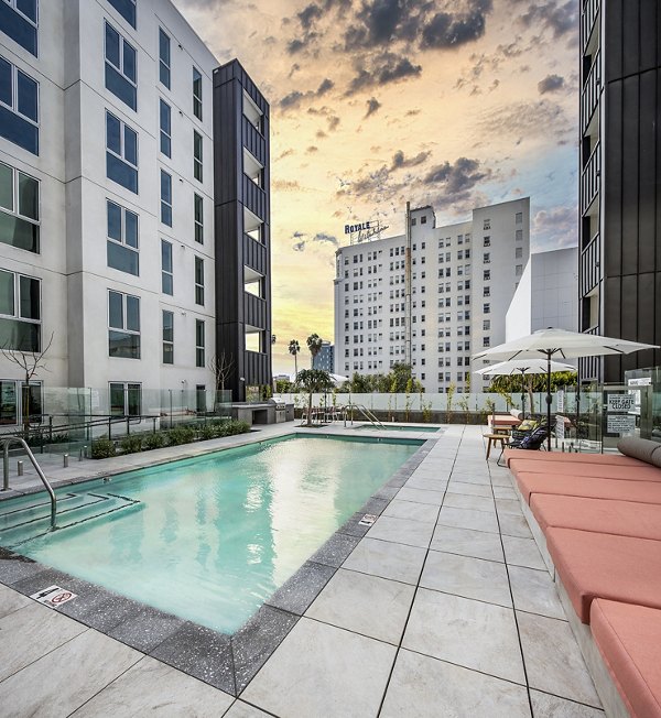 Infinity pool surrounded by lush greenery at WILCO Apartments offering luxury living experience
