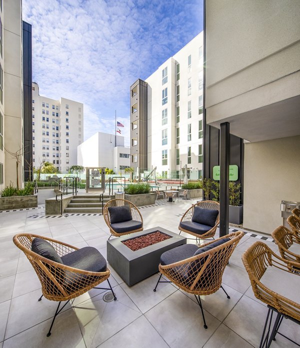 Outdoor seating with fire pit at WILCO Apartments, creating a cozy atmosphere for residents