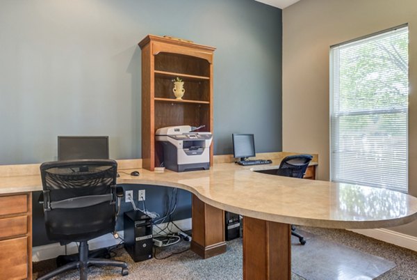 Business center with modern workstations at Copper Chase at Stones Crossing Apartments Ideal workspace for residents seeking productivity and convenience