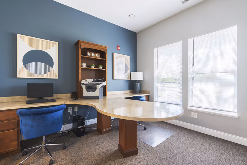 Meeting room with modern seating and large conference table at Copper Chase at Stones Crossing Apartments