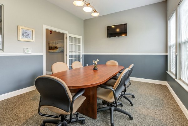 Meeting room with modern seating and large conference table at Copper Chase at Stones Crossing Apartments