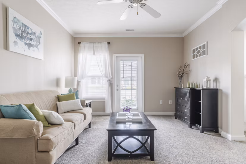 Spacious living room with elegant decor in Copper Chase at Stones Crossing Apartments