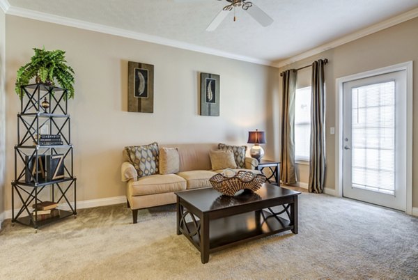 Spacious living room with elegant decor in Copper Chase at Stones Crossing Apartments