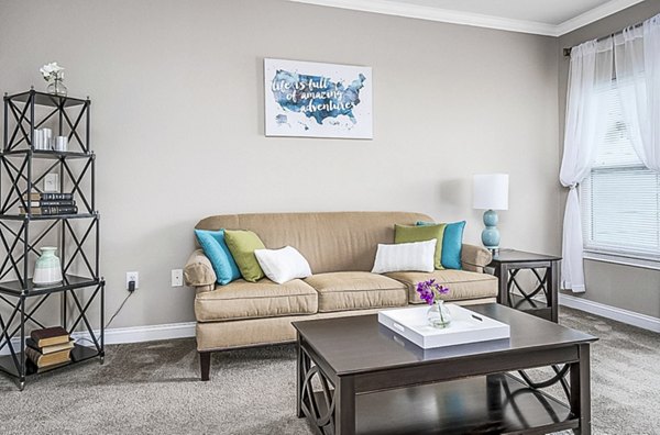Living room featuring modern decor and natural light at Copper Chase at Stones Crossing Apartments Ideal for luxury living and relaxation