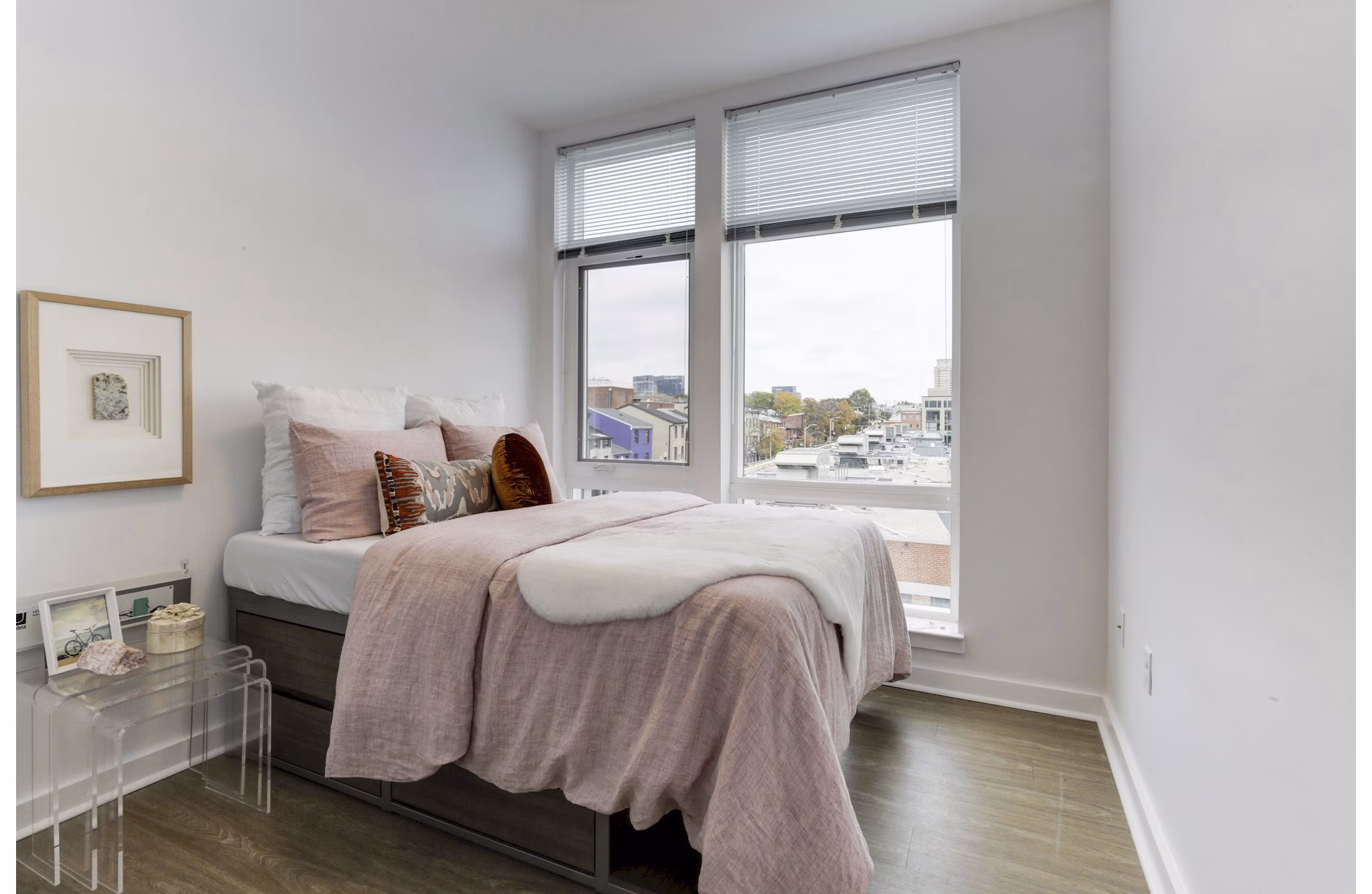 Modern bedroom with natural light and stylish decor at Wheelhouse Apartments