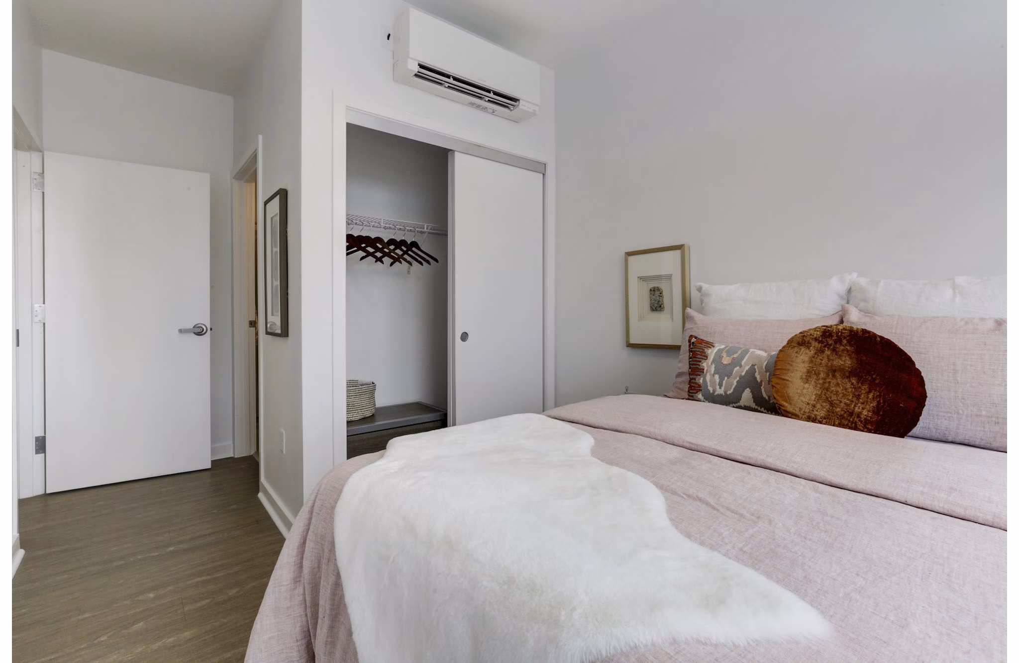 Inviting bedroom featuring contemporary design and plush bedding in Wheelhouse Apartments