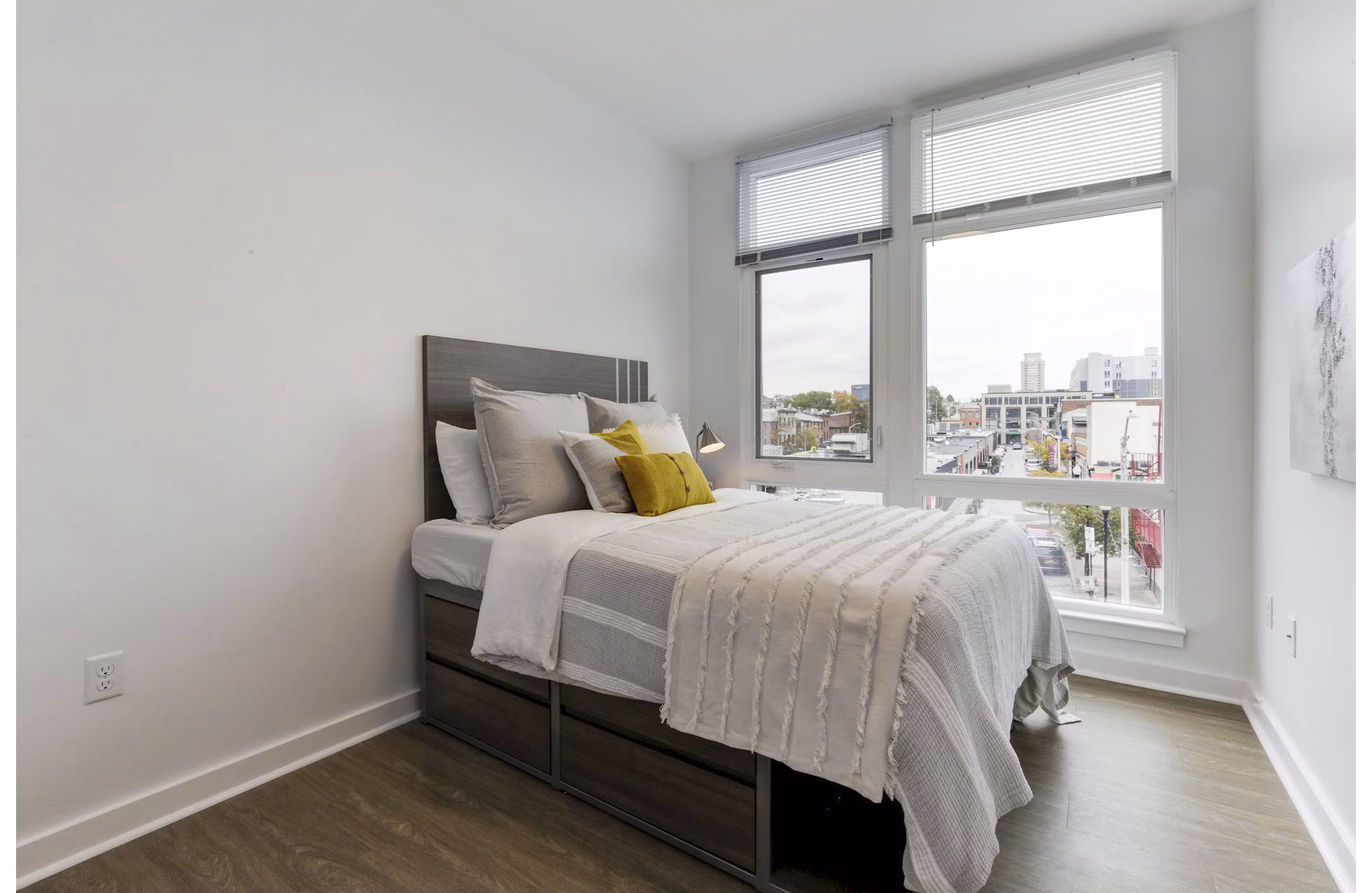 Cozy bedroom with modern furnishings in Wheelhouse Apartments