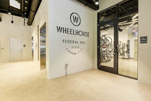 Modern clubhouse with billiards and lounge area at Wheelhouse Apartments, ideal for social gatherings and relaxation