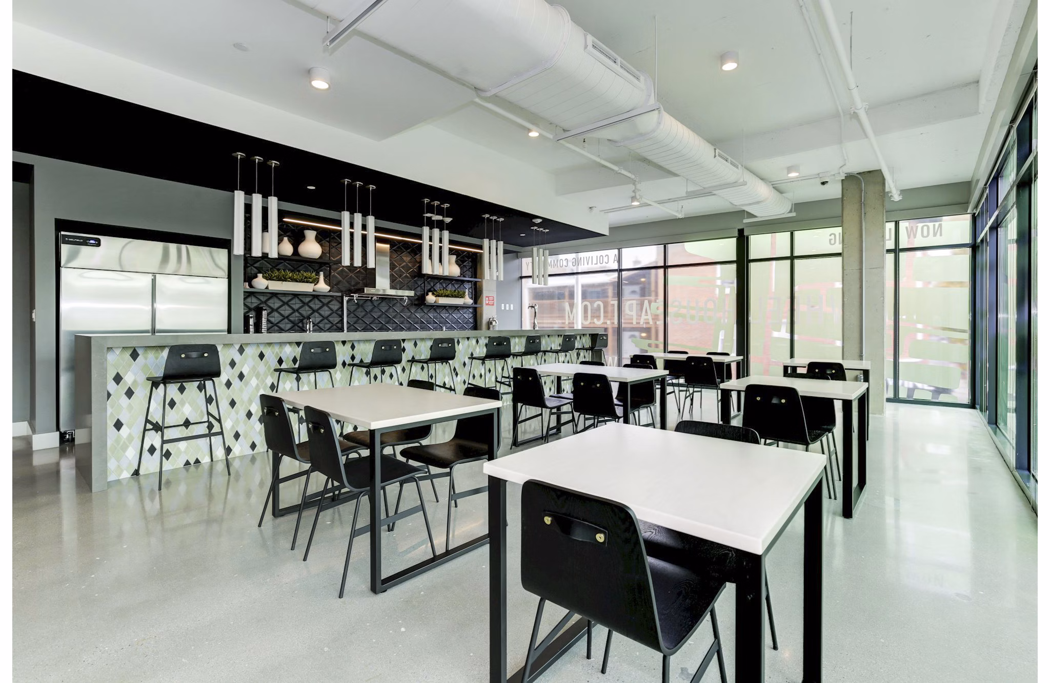 Clubhouse featuring modern design and social spaces at Wheelhouse Apartments