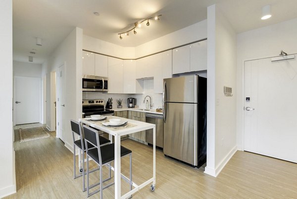 Modern kitchen with stainless steel appliances at Wheelhouse Apartments