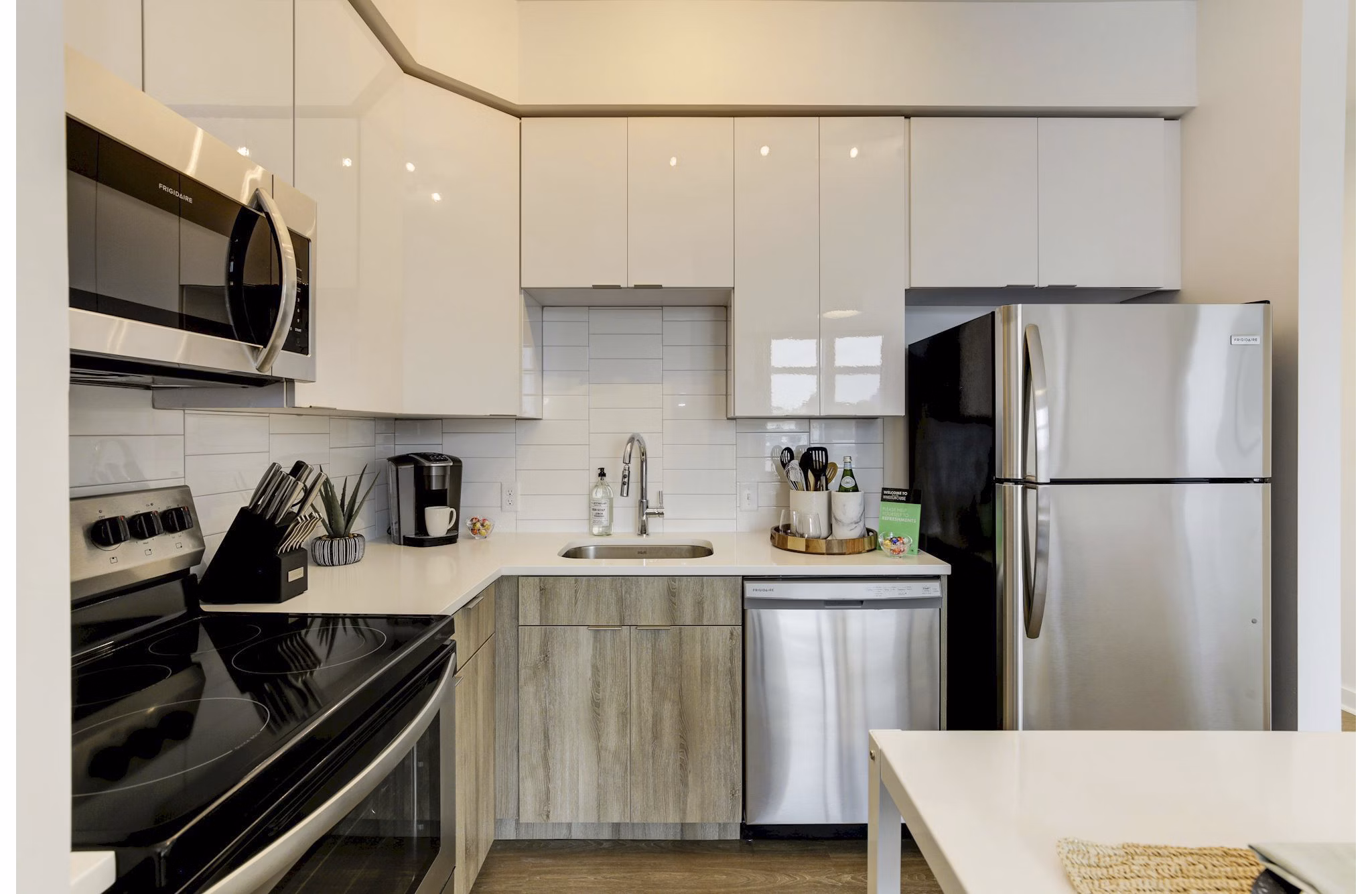 Spacious modern kitchen with stainless steel appliances in Wheelhouse Apartments