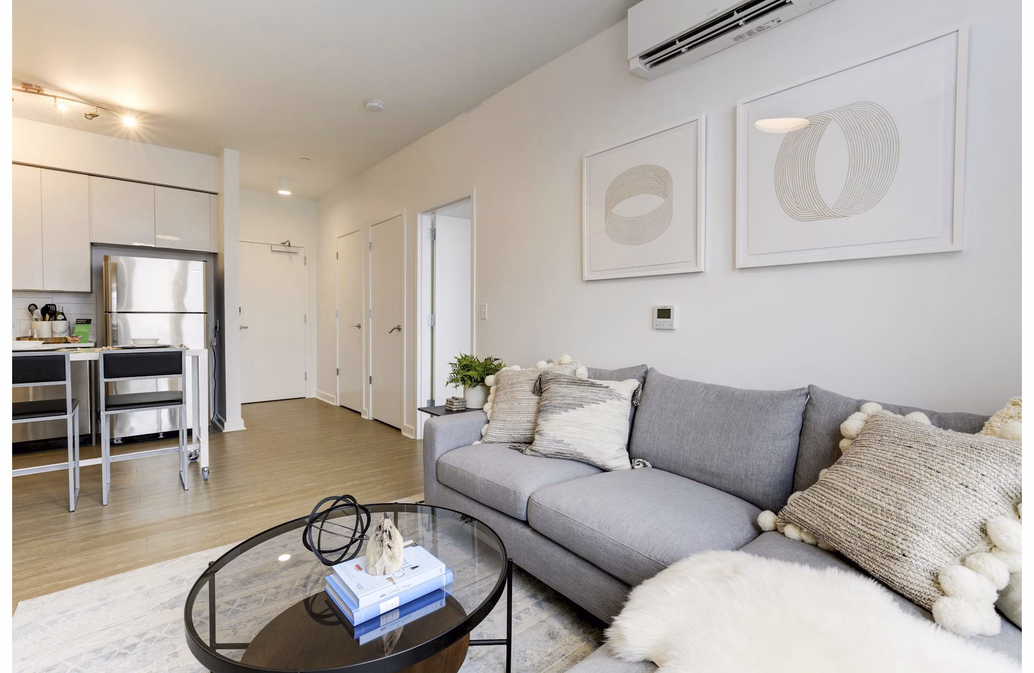Cozy living room with modern decor and ample seating at Wheelhouse Apartments
