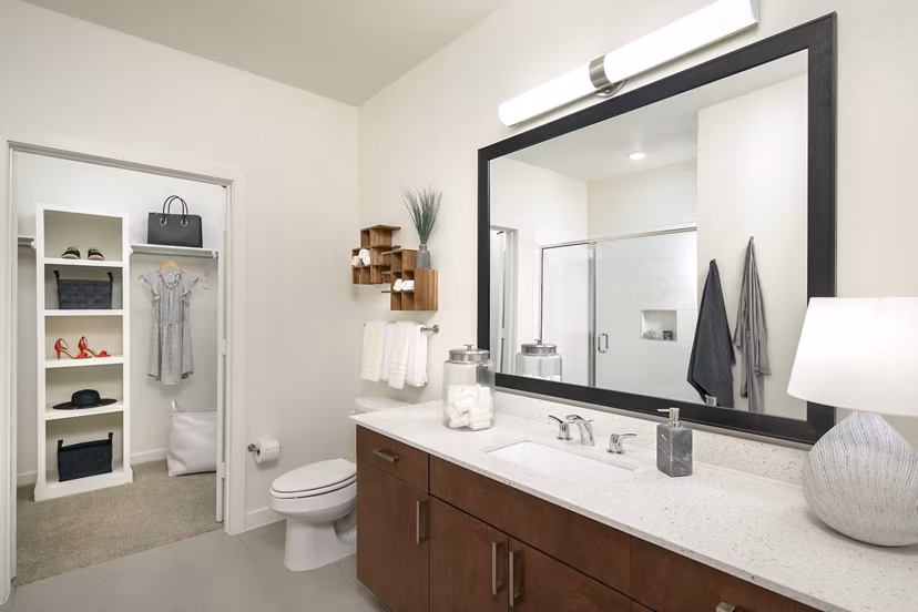 Modern bathroom with sleek fittings in The Upton at Longhorn Quarry Apartments, offering luxury living spaces in a serene neighborhood setting