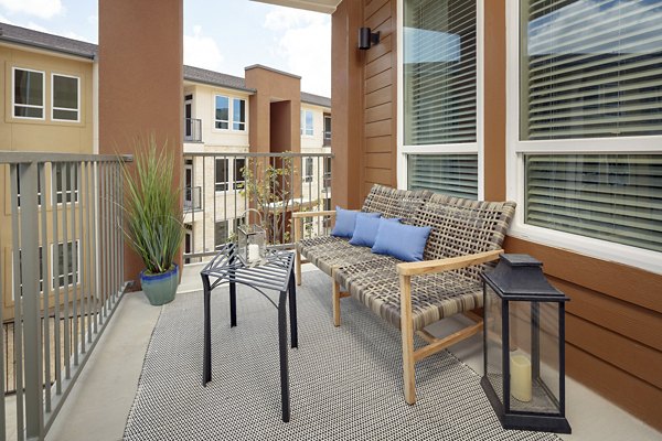 Patio with stylish outdoor seating at The Upton at Longhorn Quarry Apartments