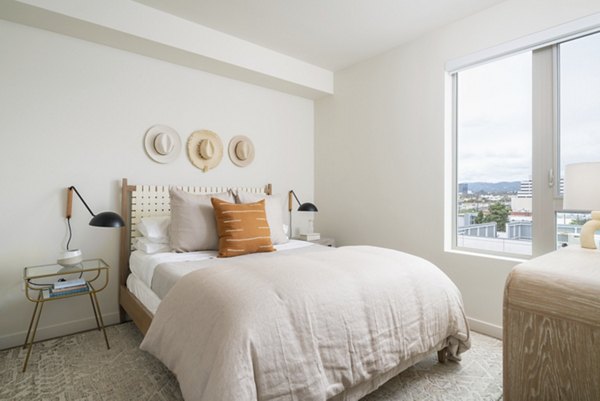 Cozy bedroom featuring modern decor at Linea Apartments in upscale neighborhood Perfect for comfortable living