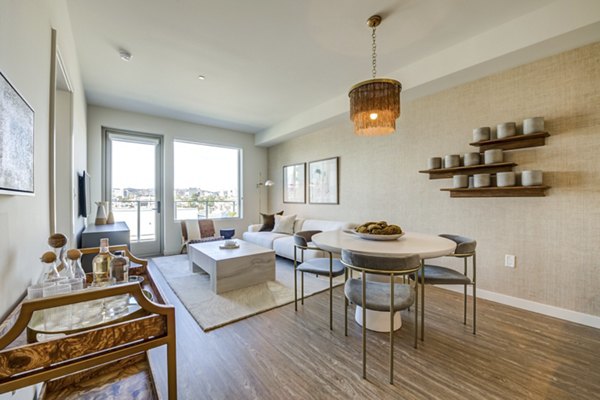Dining area with modern design and elegant lighting at Linea Apartments, featuring stylish seating and spacious layout
