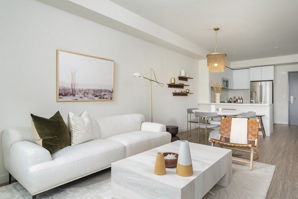 Elegant living room with modern dÃ©cor and natural light at Linea Apartments