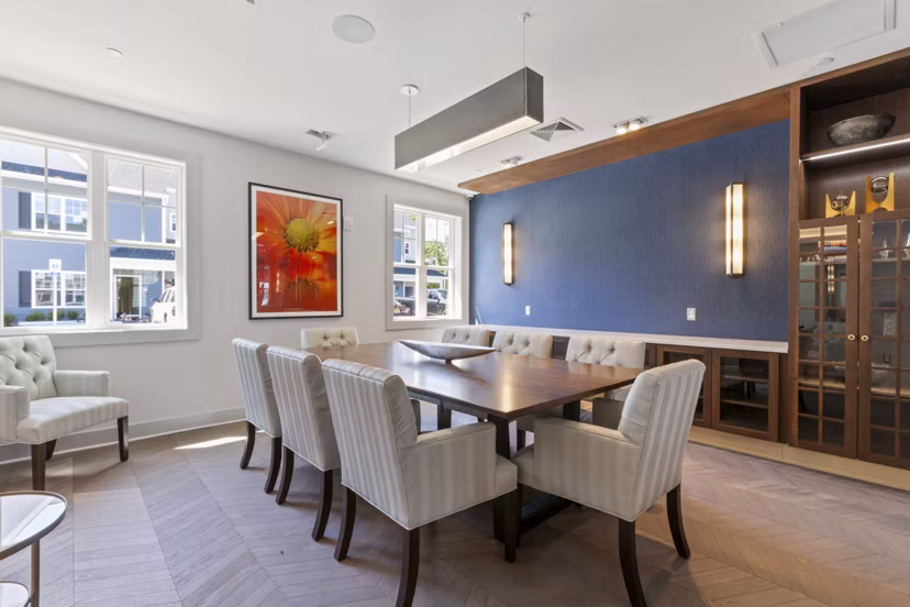 Meeting facility with conference tables and chairs at The Cornerstone Hauppauge Apartments