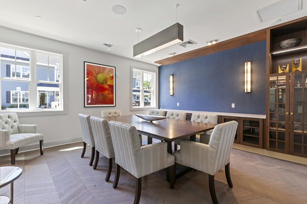 Meeting facility with conference tables and chairs at The Cornerstone Hauppauge Apartments