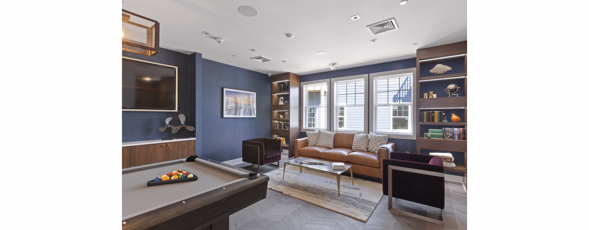 Elegant clubhouse featuring modern decor at The Cornerstone Hauppauge Apartments, ideal for social gatherings and community events