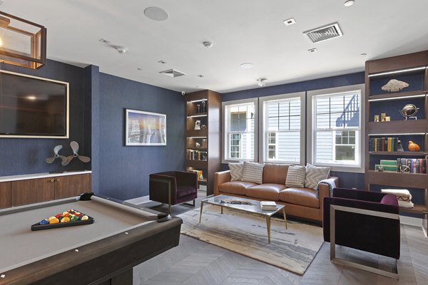 Elegant clubhouse featuring modern decor at The Cornerstone Hauppauge Apartments, ideal for social gatherings and community events