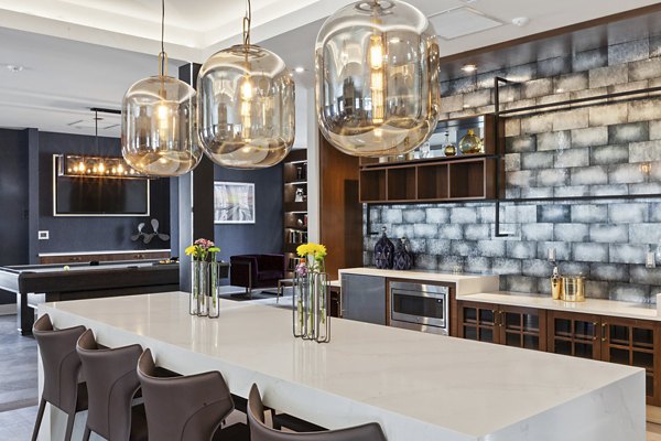 Elegant clubhouse with lounge seating and game area at The Cornerstone Hauppauge luxury apartments