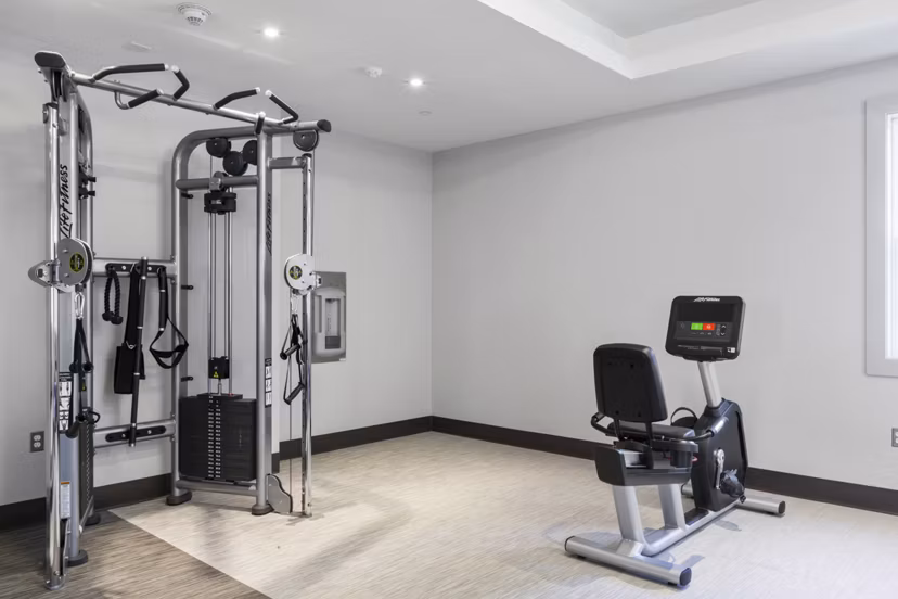 State-of-the-art fitness center at The Cornerstone Hauppauge Apartments with modern exercise equipment and spacious workout areas