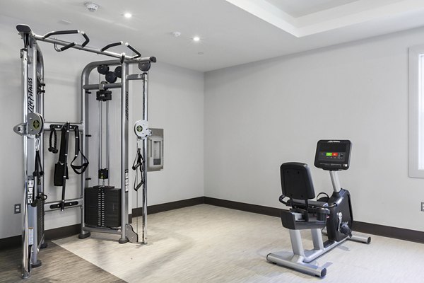 State-of-the-art fitness center at The Cornerstone Hauppauge Apartments with modern exercise equipment and spacious workout areas