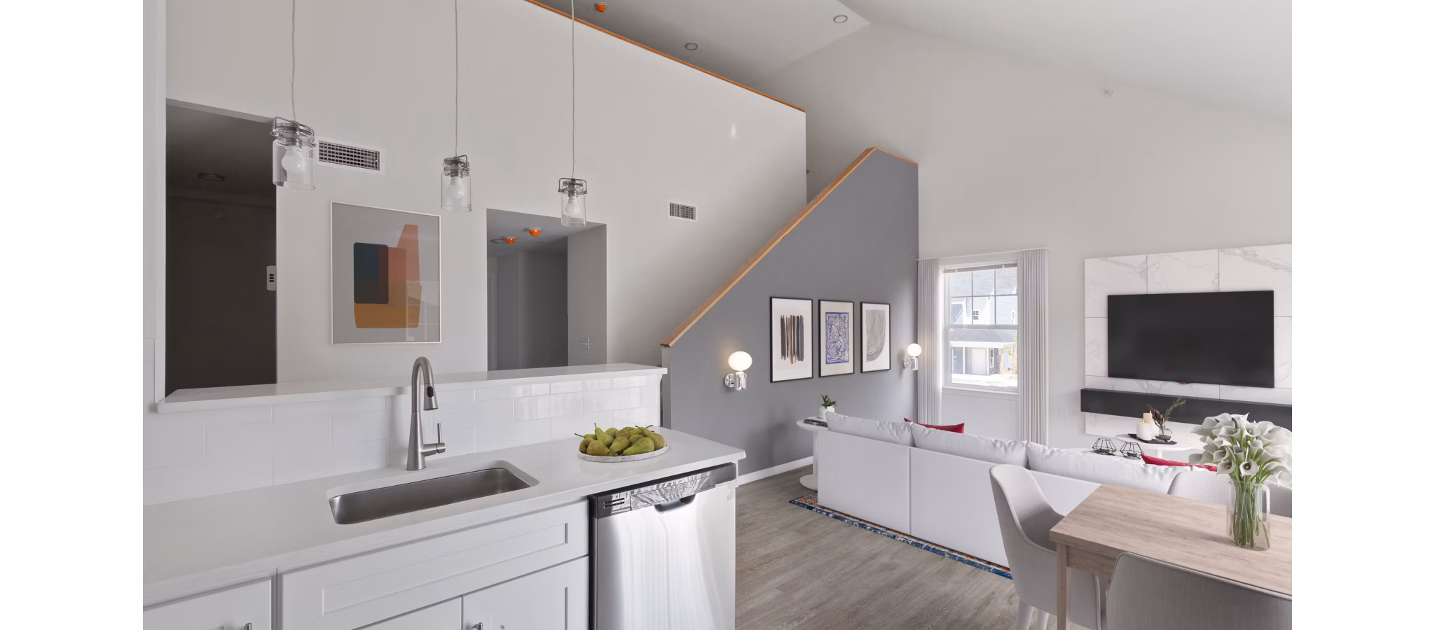 Modern kitchen with stainless steel appliances in The Cornerstone Hauppauge Apartments