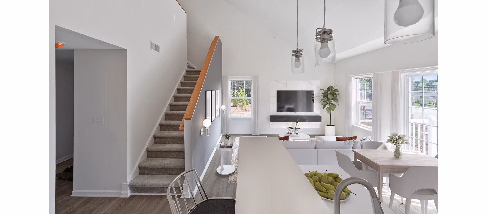 Spacious living room with stylish decor in The Cornerstone Hauppauge Apartments